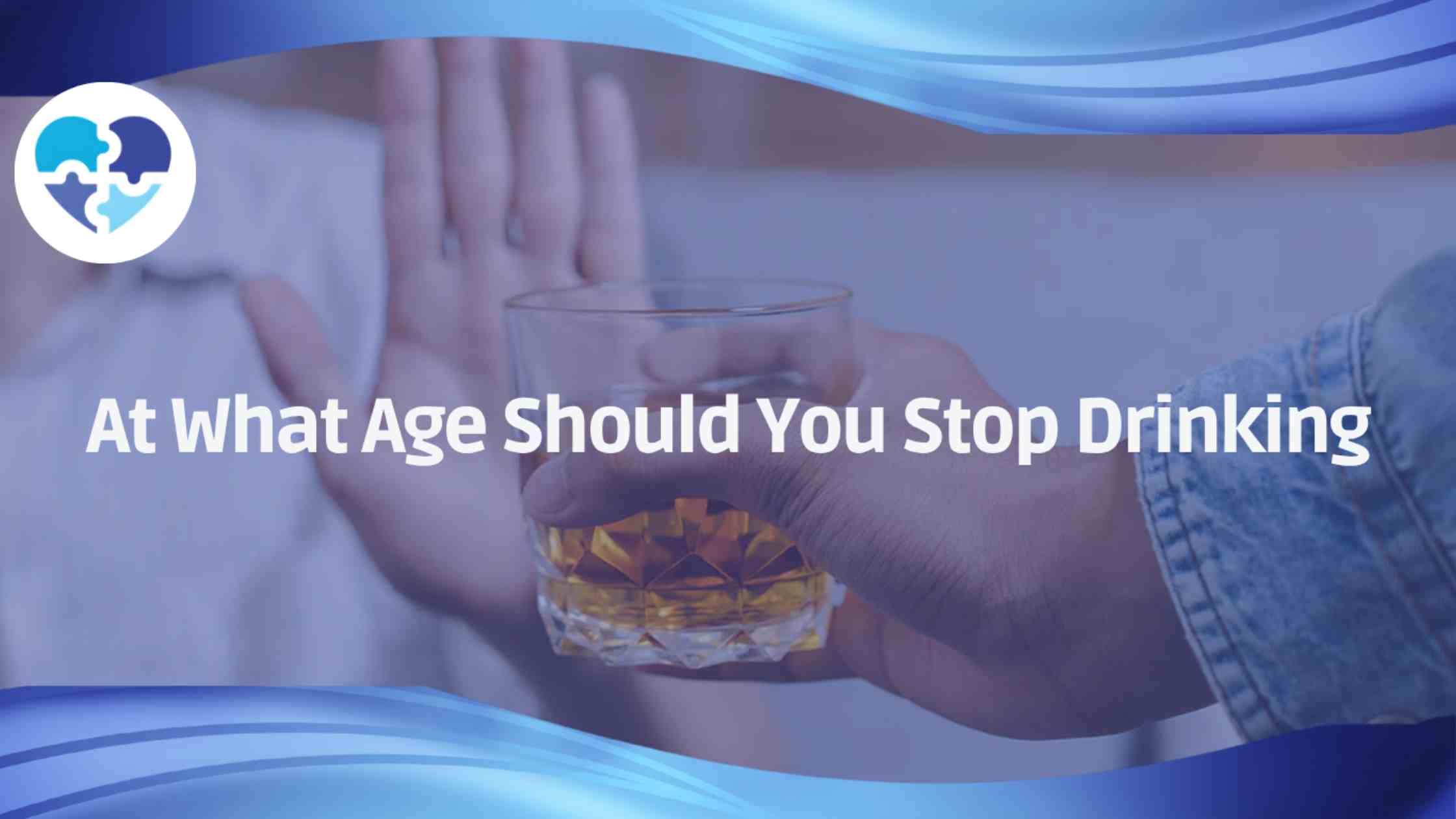 Hand refusing a whiskey glass, overlaid with the question “At What Age Should You Stop Drinking?”.
