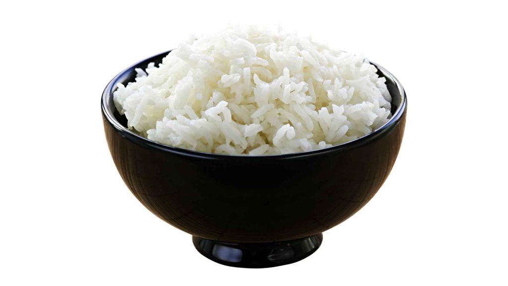 Bowl of plain white rice, representing a bland diet option for managing symptoms of alcoholic gastritis.