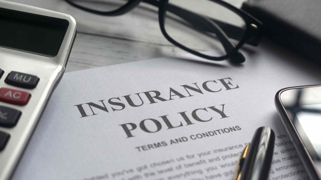 Insurance policy documents, symbolizing coverage limits as a common challenge with BCBS outpatient coverage.