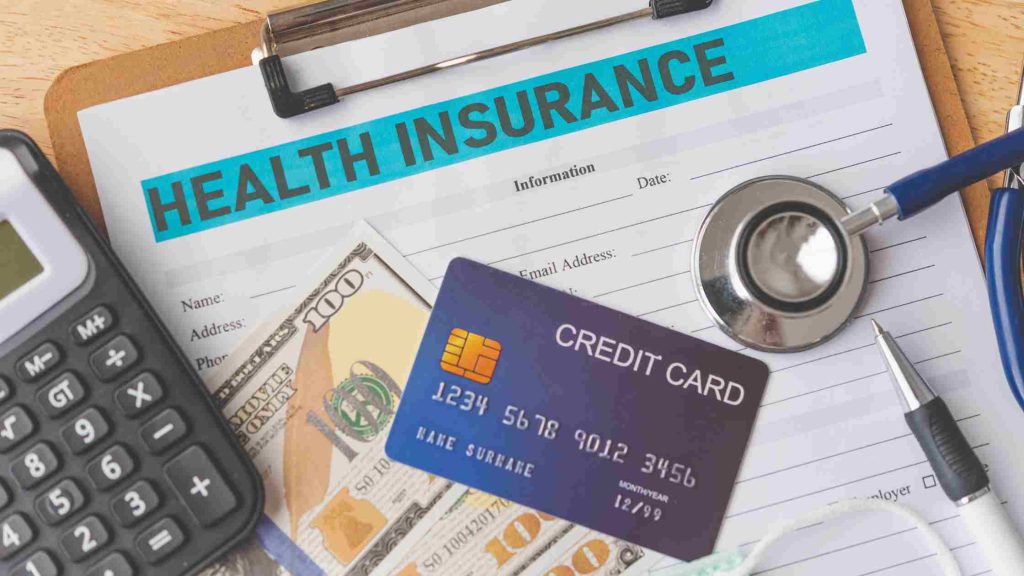 Health insurance form with credit card, and cash, showing challenges in coordinating disability and insurance departments.