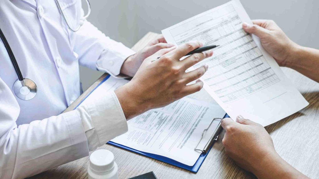 Doctor providing a recommendation note, a required step for filing a short-term disability claim for opioid rehab.