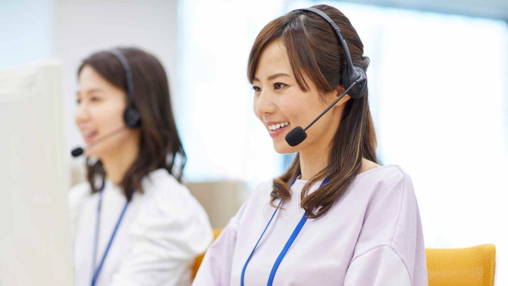 Support staff assists patients, highlighting treatment center’s service to verify Blue Cross outpatient coverage in Arizona.