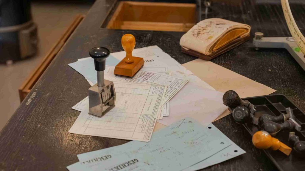 Scattered authorization forms and approval stamps symbolizing common insurance delays and how to overcome them effectively.