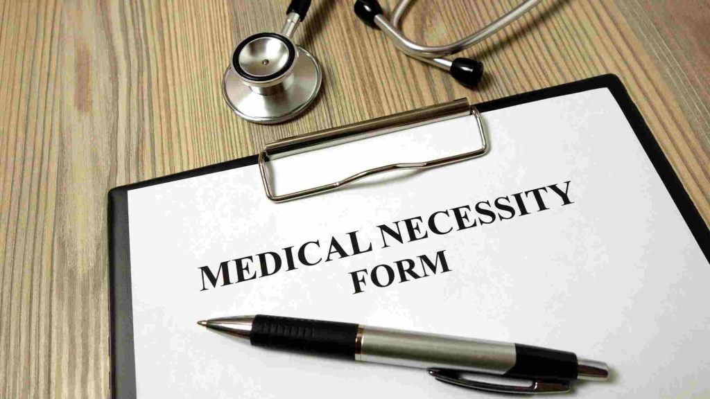 A medical necessity form with stethoscope-pen, representing how Aetna determines mental health rehab coverage eligibility.